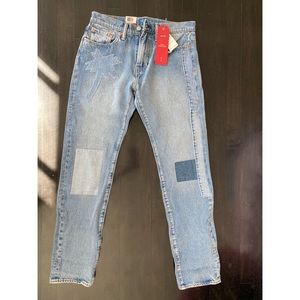Patched Levi’s 502 tapered leg